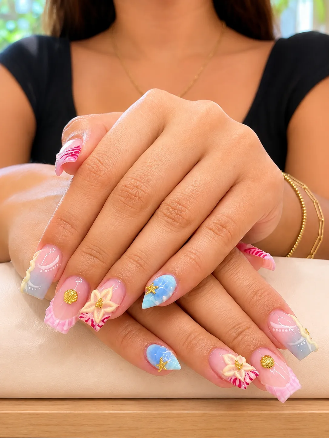 Close-up of sculpted nails with three-dimensional nail art detailing
